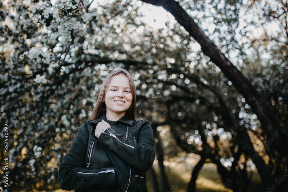 portrait of a cute girl in a flowered park. portrait of a cute girl in a flowered park.