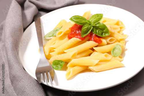 pasta with tomato sauce and basil photo