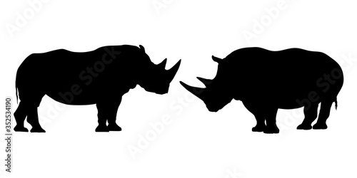Set of black and white silhouettes of rhinoceros with two horns - isolated on white background - vector