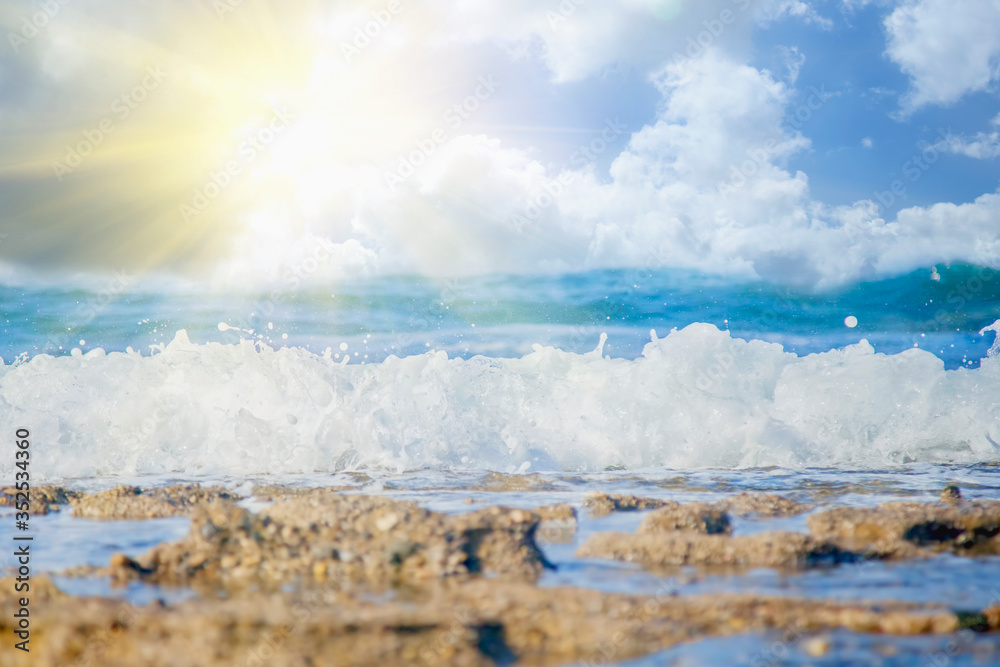 Fototapeta premium Fantastic view of sea wave crashing on the rock and make a splashing water with bubble.