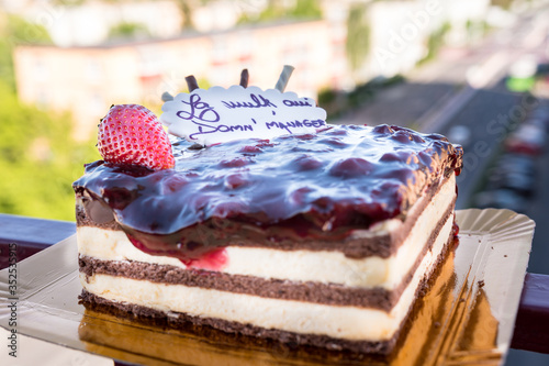 A closeup of a multilayered cake with decorations photo