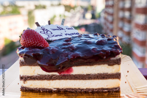 A closeup of a multilayered cake with decorations photo