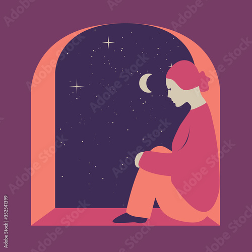 Girl sitting near a window  night starry sky in the background. Concept of loneliness  melancholy   quarantine  sadness.