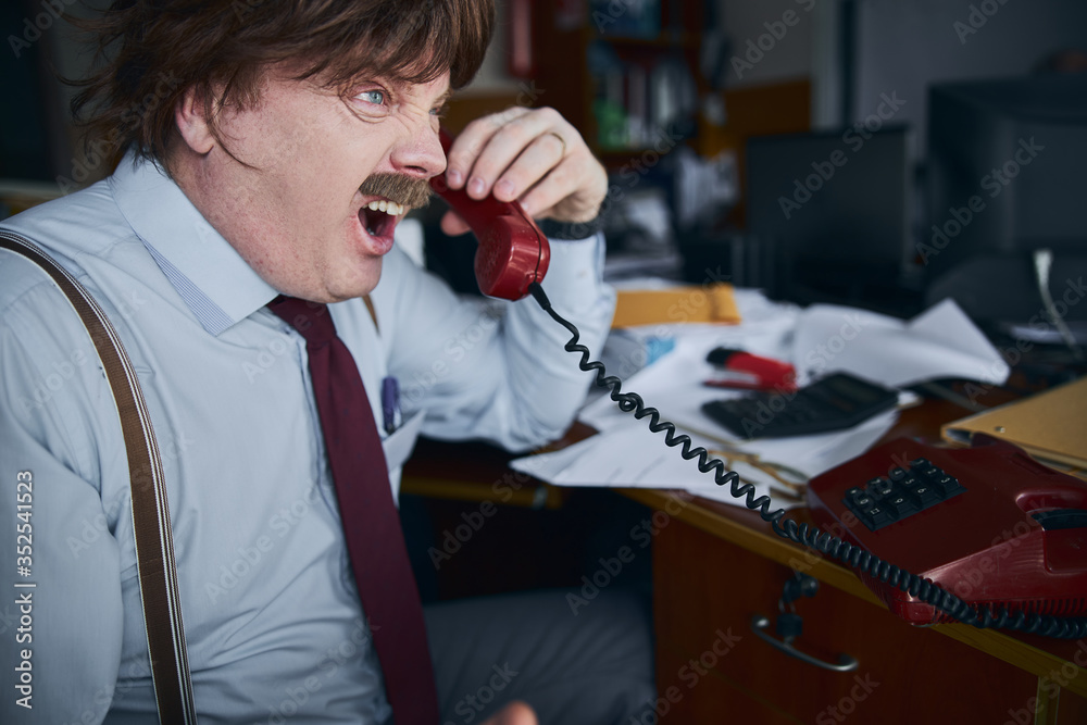 © Yakobchuk Olena - Furious broker shouting to the phone in his office © Yakobchuk Olena - Furious broker shouting to the phone in his office