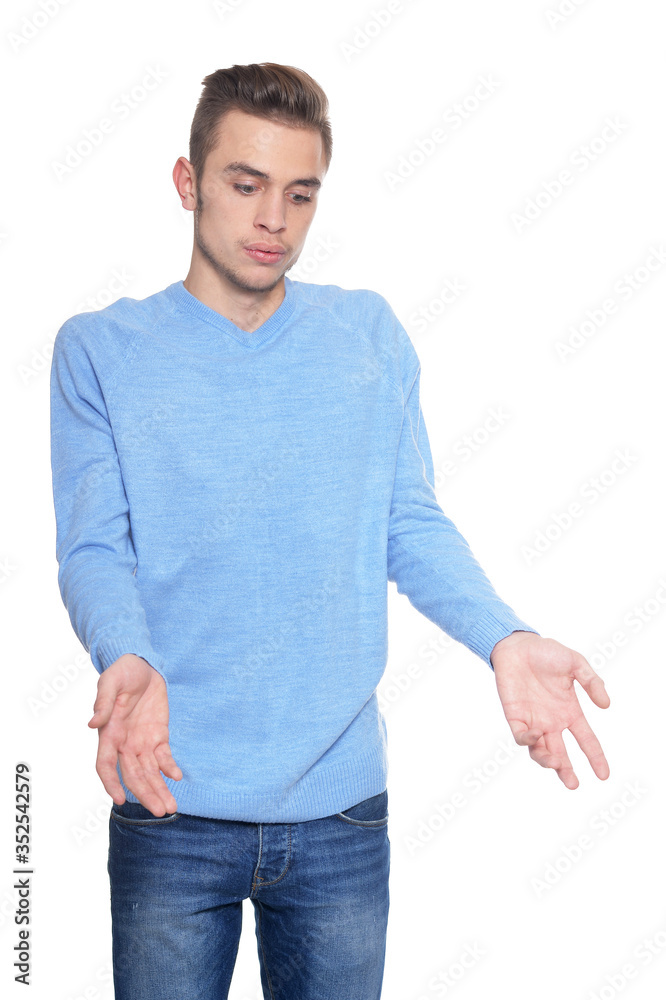Fototapeta premium Handsome young man posing against white background