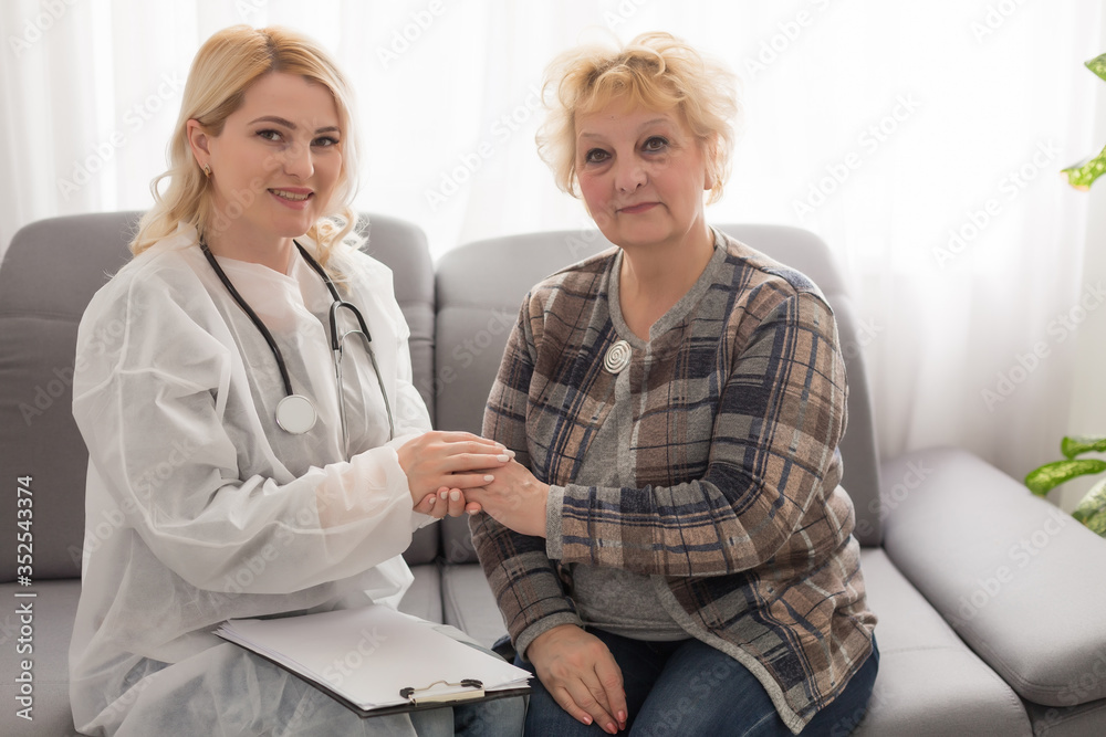 Senior woman with her home caregiver Senior woman with her home caregiver