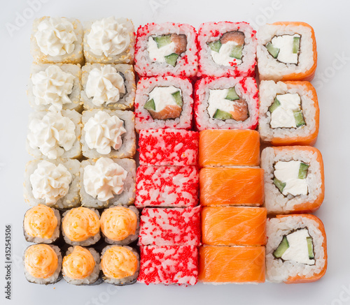 Big sushi rolls set isolated on white background. Tasty fresh sushi rolls. Japanese cousine, asian food. Seafood, fish, rice