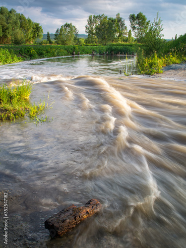 Rapids on a stream into a lake in Burgenland photo
