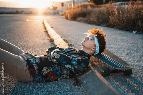 Young Man Longboard in the Street. photo