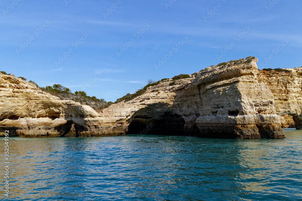 Caves and arches in the rock formations along the coastline, Algarve, Portugal. Caves and arches in the rock formations along the coastline, Algarve, Portugal.