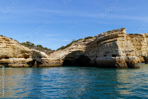 Caves and arches in the rock formations along the coastline, Algarve, Portugal.