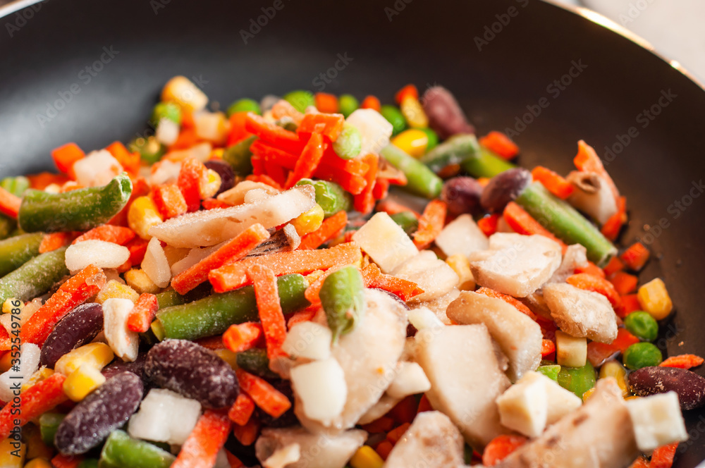 A versatile and affordable instant mix of frozen beans, asparagus, mushrooms, corn, carrots and peas in a pan A versatile and affordable instant mix of frozen beans, asparagus, mushrooms, corn, carrots and peas in a pan