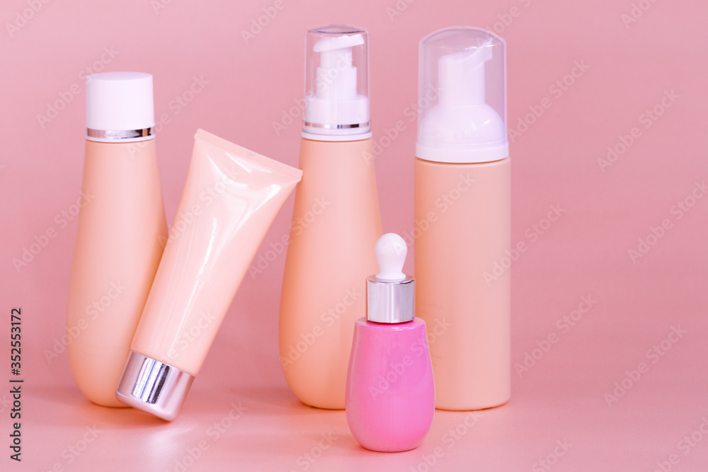 blank bottle packaging with natural cosmetic cream, serum, skincare, lotion, tonic. bio organic product on peach color background. spa concept. Plastic bottle label design. Cosmetic design template. blank bottle packaging with natural cosmetic cream, serum, skincare, lotion, tonic. bio organic product on peach color background. spa concept. Plastic bottle label design. Cosmetic design template.