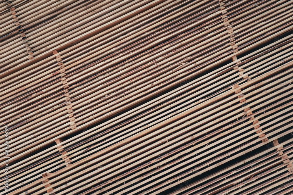 Fototapeta premium Wood and Sawmill. Large round logs harvested for construction.