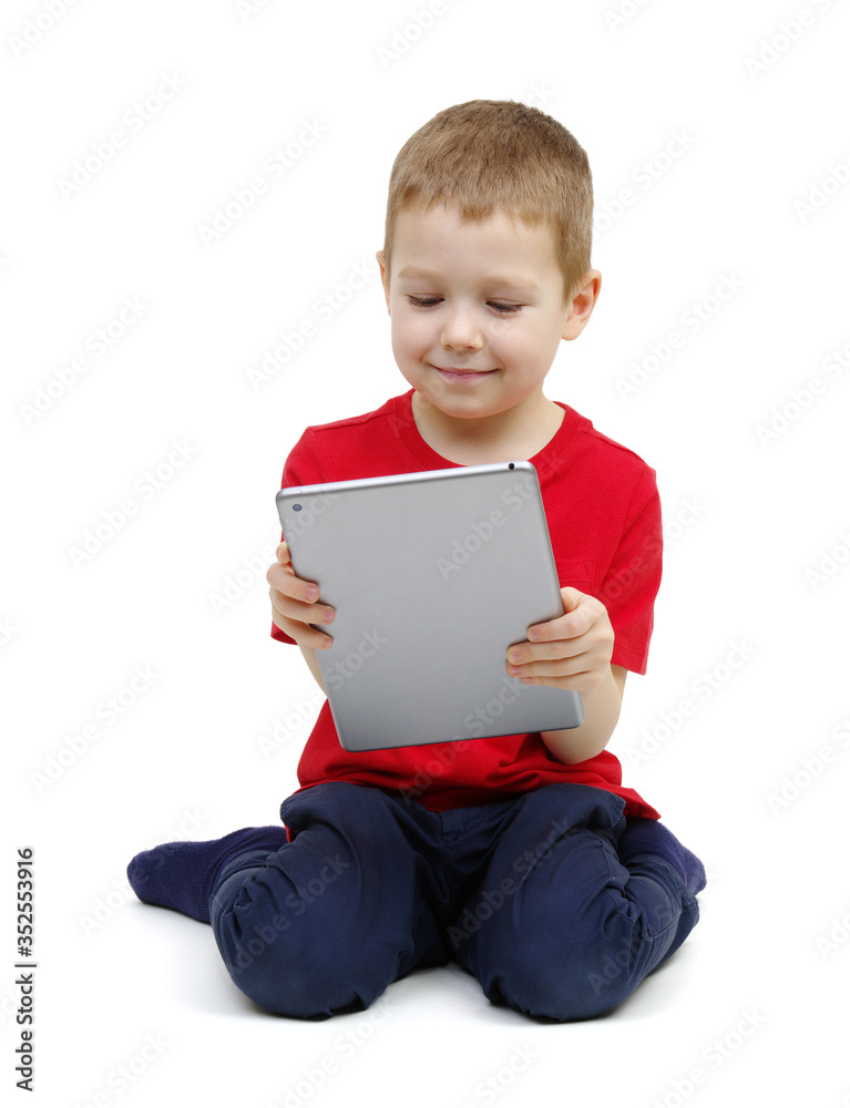 little boy looking at digital tablet computer little boy looking at digital tablet computer