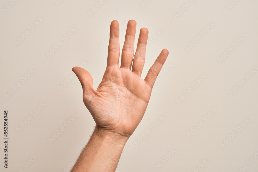 Hand of caucasian young man showing fingers over isolated white background counting number 5 showing five fingers Hand of caucasian young man showing fingers over isolated white background counting number 5 showing five fingers