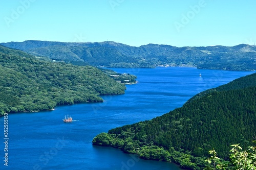 The view of Japanese lake with pleasure boat.
