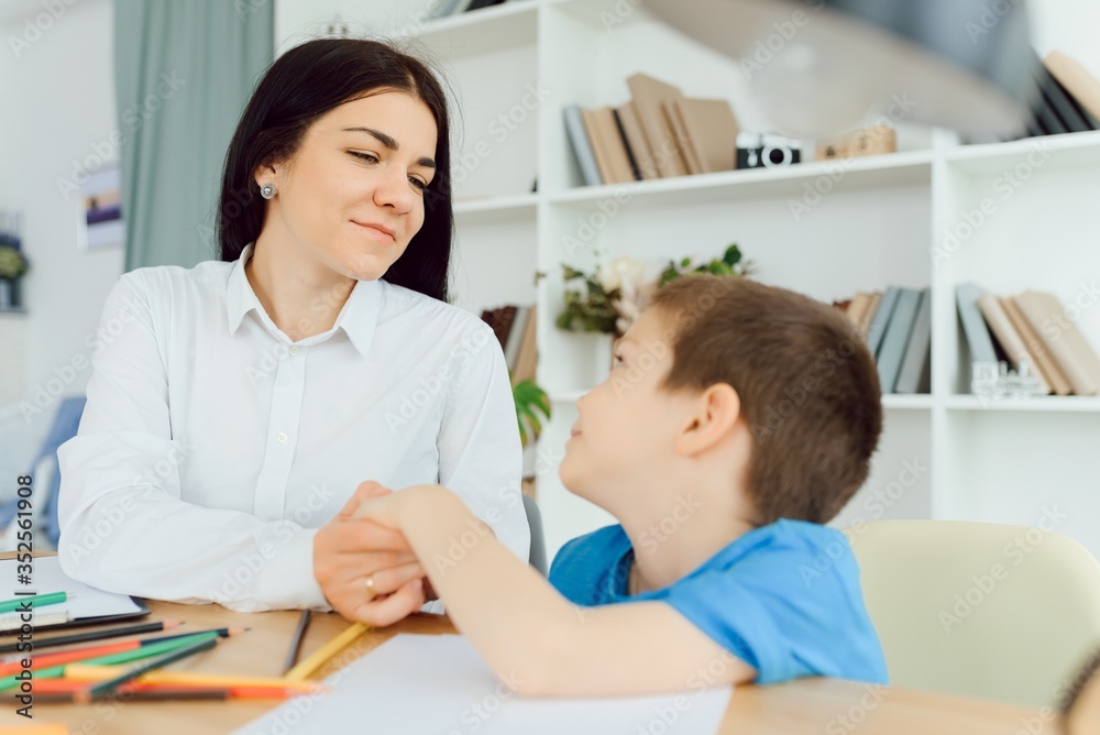 Child psychologist attending small boy. The concept of psychological assistance to children. Child psychologist attending small boy. The concept of psychological assistance to children.