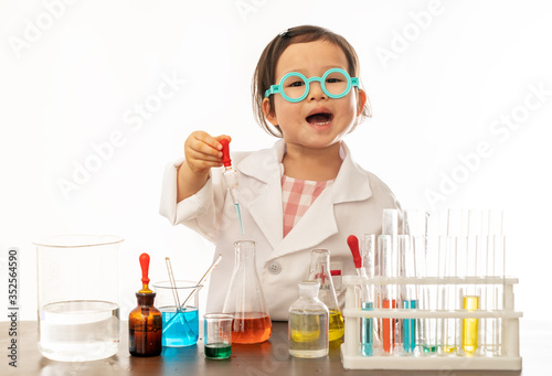 The lovely girl is doing experiments and dreaming of becoming a scientist