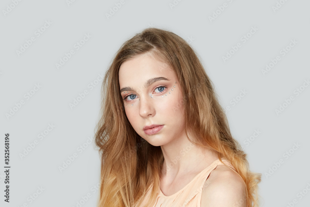 Portrait of a blonde girl with blue eyes. Long hair. Portrait of a blonde girl with blue eyes. Long hair.