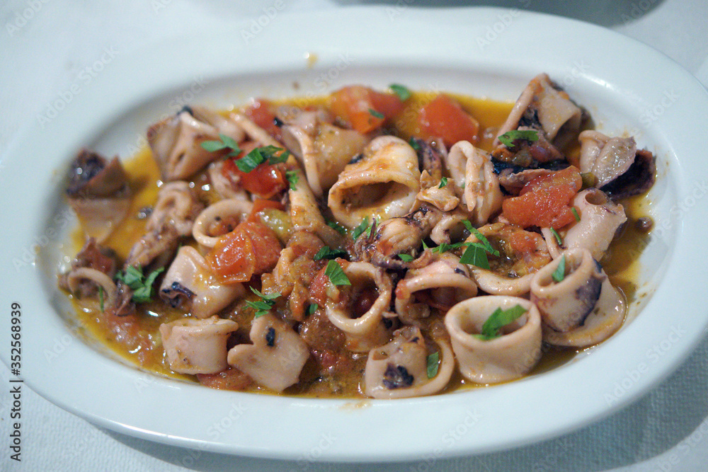 Kalamaretti and squid in broth in a tavern in Kalamata Kalamaretti and squid in broth in a tavern in Kalamata