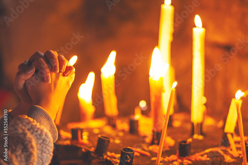 Woman praying in church photo