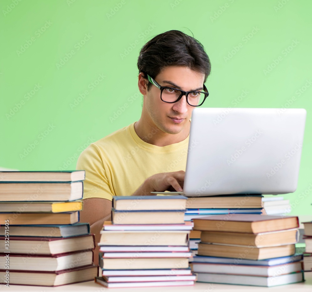 Student with too many books to read before exam