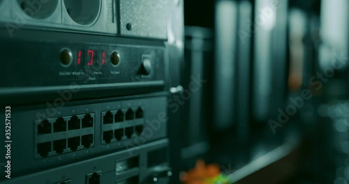 Blinking 101 red lights on a switch in a datacenter or network room rack indicating that a reset has been made or a new set up has been added to the network