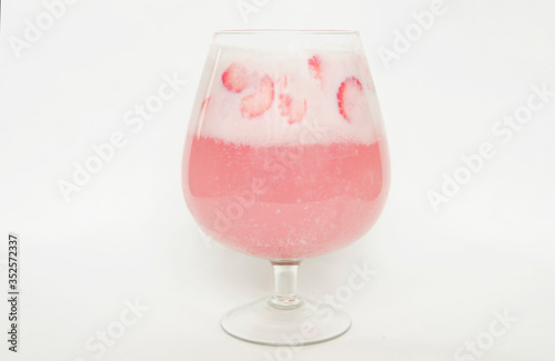 Strawberry cocktail in glass on white background