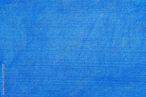 Light blue denim fabric photographed close up