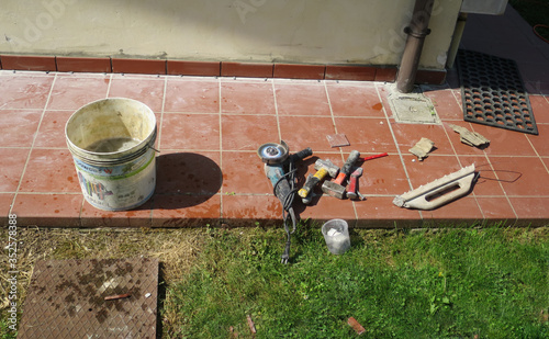 work tools leaning on the pavement ready to be used photo