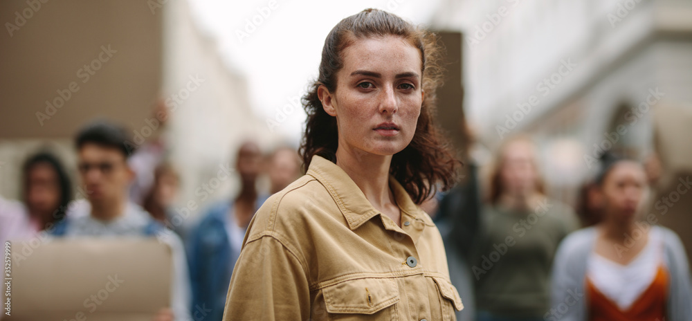 Fototapeta premium Female activist leading a protest for their civil rights