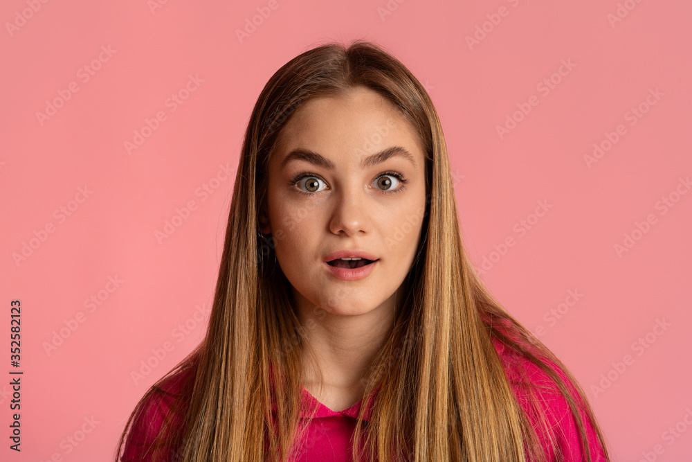 Image of excited teen girl isolated on pink background, looking camera Image of excited teen girl isolated on pink background, looking camera