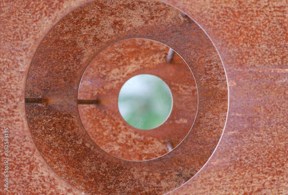 Circular metal structure. Rust marks.