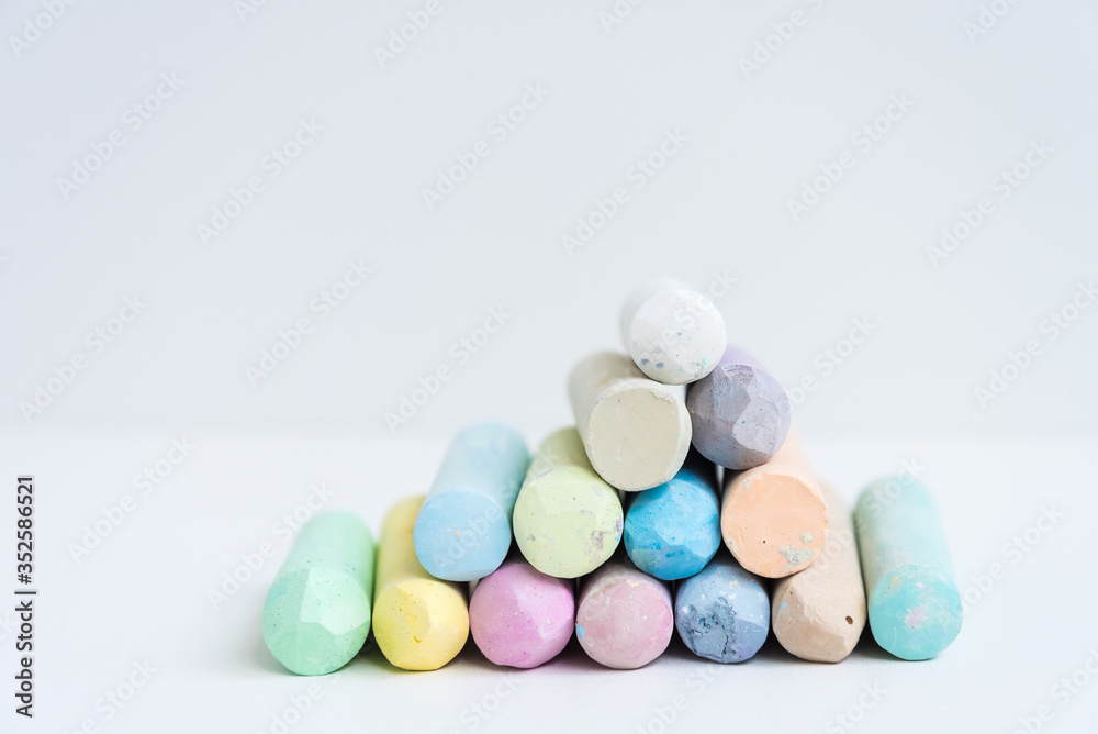Colored crayons, stacked on top of each other, slide. Variety of color. Background, texture. Space for text Colored crayons, stacked on top of each other, slide. Variety of color. Background, texture. Space for text