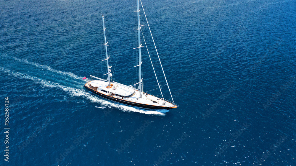 Aerial drone photo of sail yacht sailing the Aegean deep blue sea, Greece