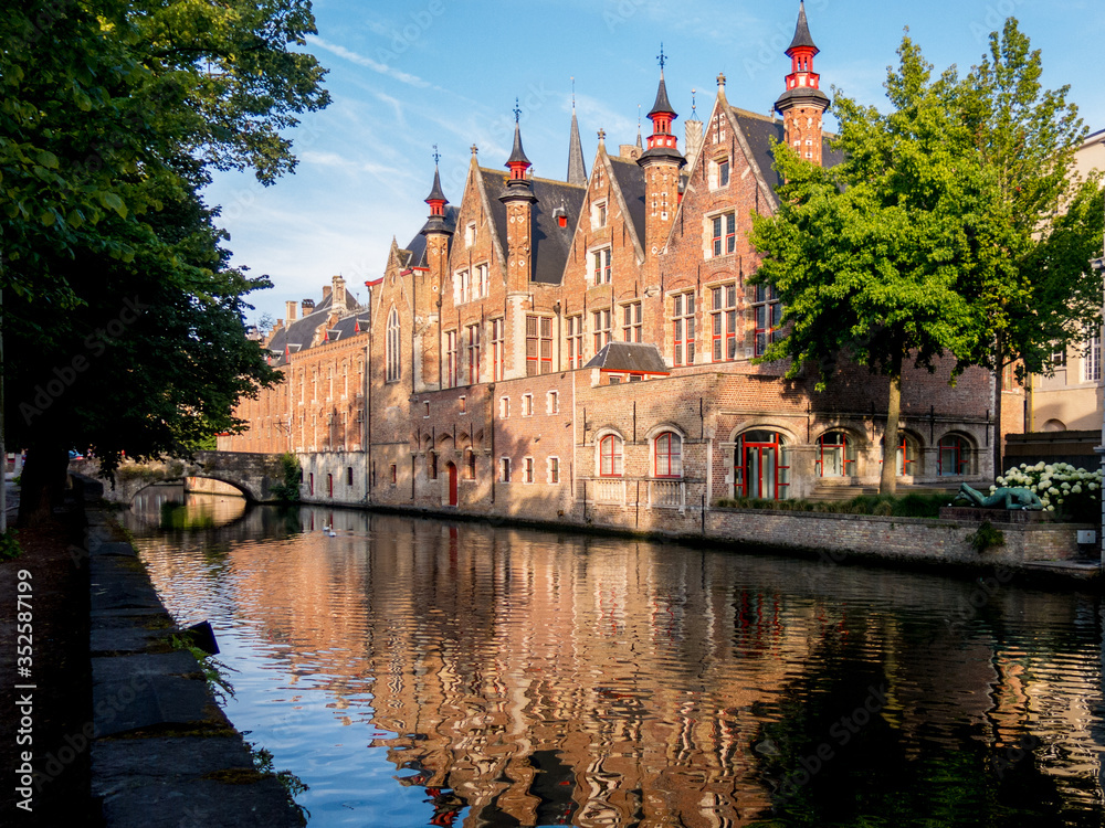 Building and reflection along Canal in Bruges, Belgium Building and reflection along Canal in Bruges, Belgium