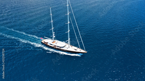 Aerial drone photo of sail yacht sailing the Aegean deep blue sea, Greece