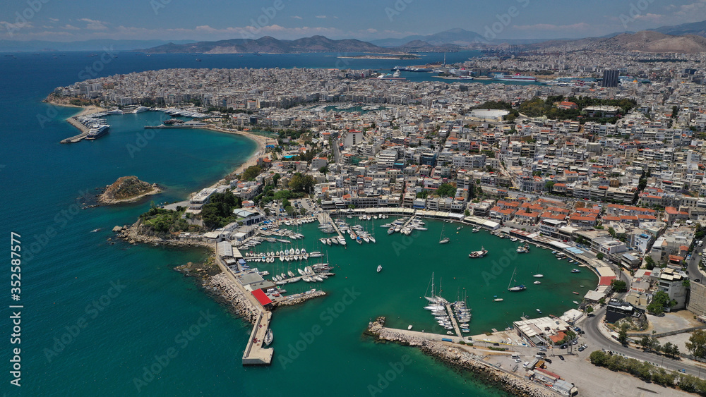 Aerial drone photo of famous round port of Mikrolimano in urban seascape of Piraeus, Attica, Greece