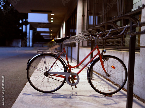 Lone red bike parked in a desolated place