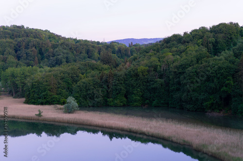 Landscape of a lake with hills in the horizon