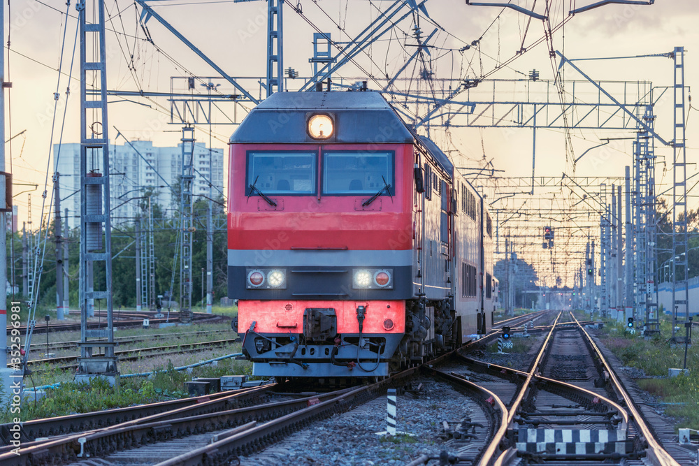Passenger train departs at sunset time. Moscow. Passenger train departs at sunset time. Moscow.