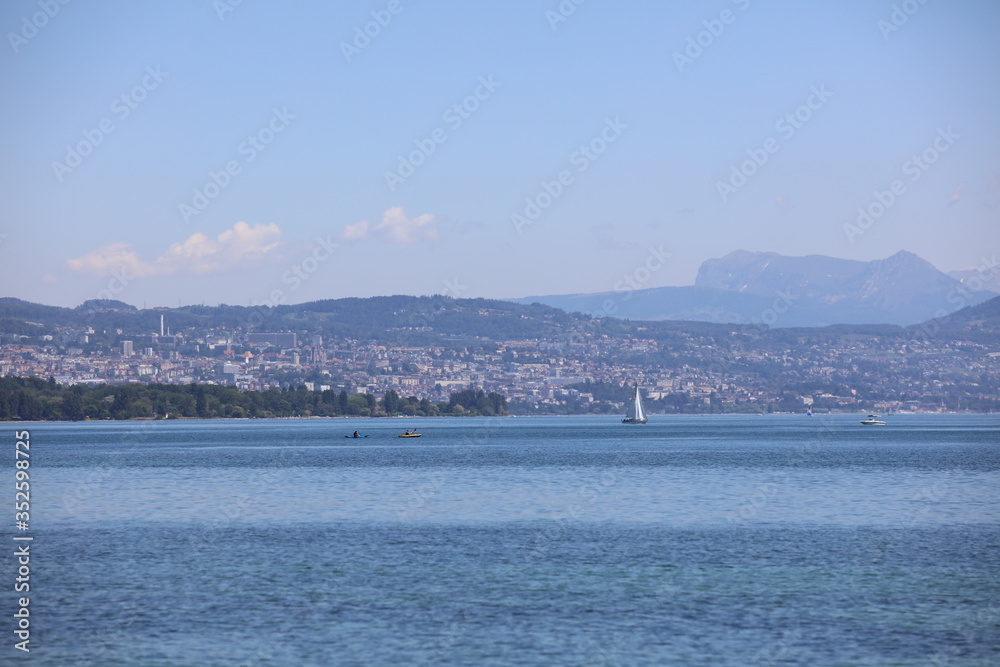 Sail boat in front of the city of Lausanne Sail boat in front of the city of Lausanne
