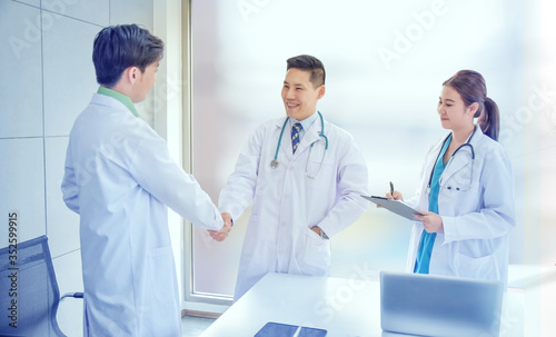 Doctor shake hand success trust in teamwork medical healthcare and insurance concept