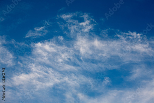 Fototapeta Naklejka Na Ścianę i Meble -  White clouds on blue sky background