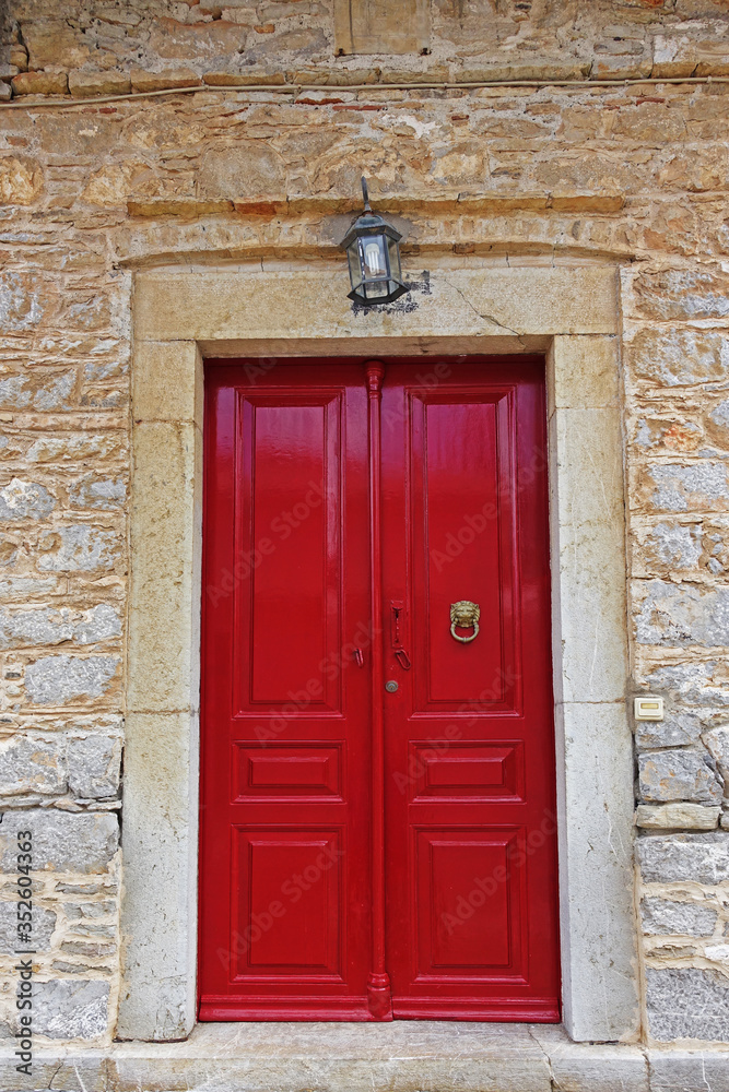 Old red front door on symi island