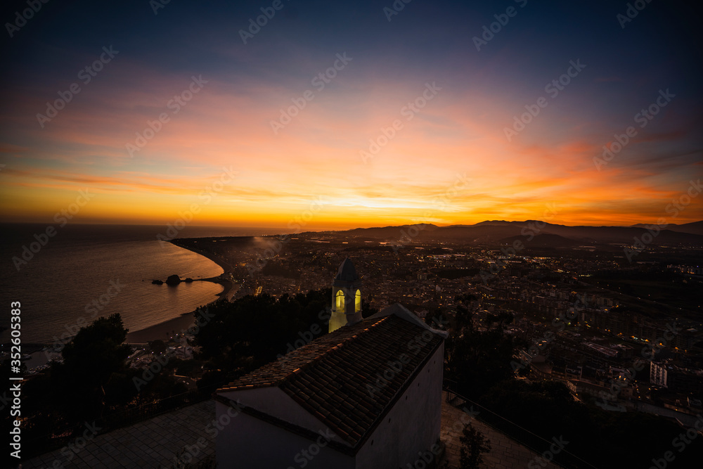 sunset in the city in costa brava, over the mediterranean sea sunset in the city in costa brava, over the mediterranean sea