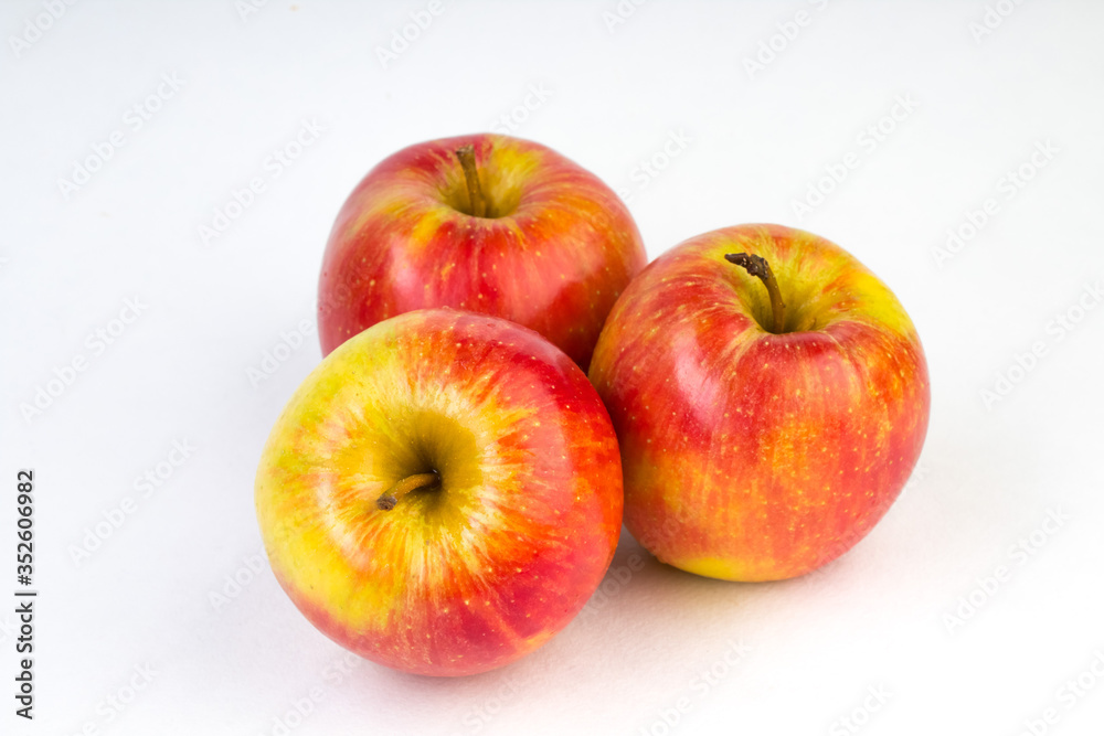 a juicy red apples on a white background. a juicy red apples on a white background.