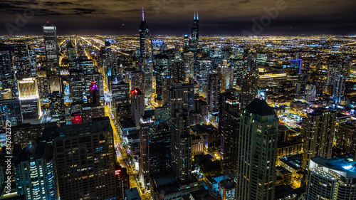 Aerial view of Chicago downtown at night from John Hancock skyscraper high above