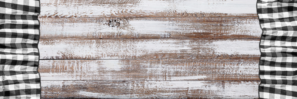 Empty wooden deck table with napkin tablecloth Empty wooden deck table with napkin tablecloth